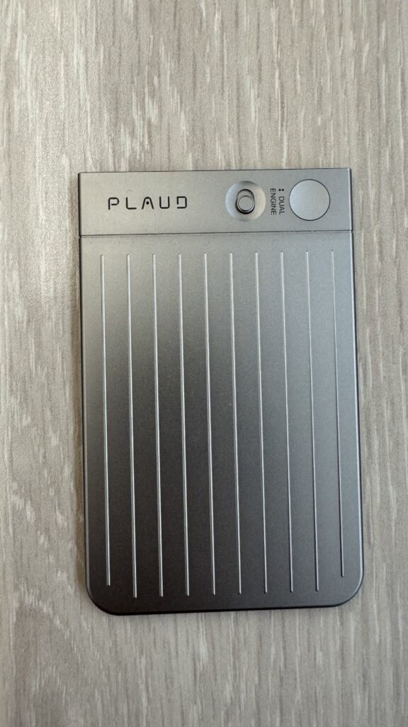 The Plaud Note device from front on in Silver colour out of its case.